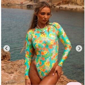 NWT Kulani kinis long sleeve surf suit. Color sunkissed soul. Size xs